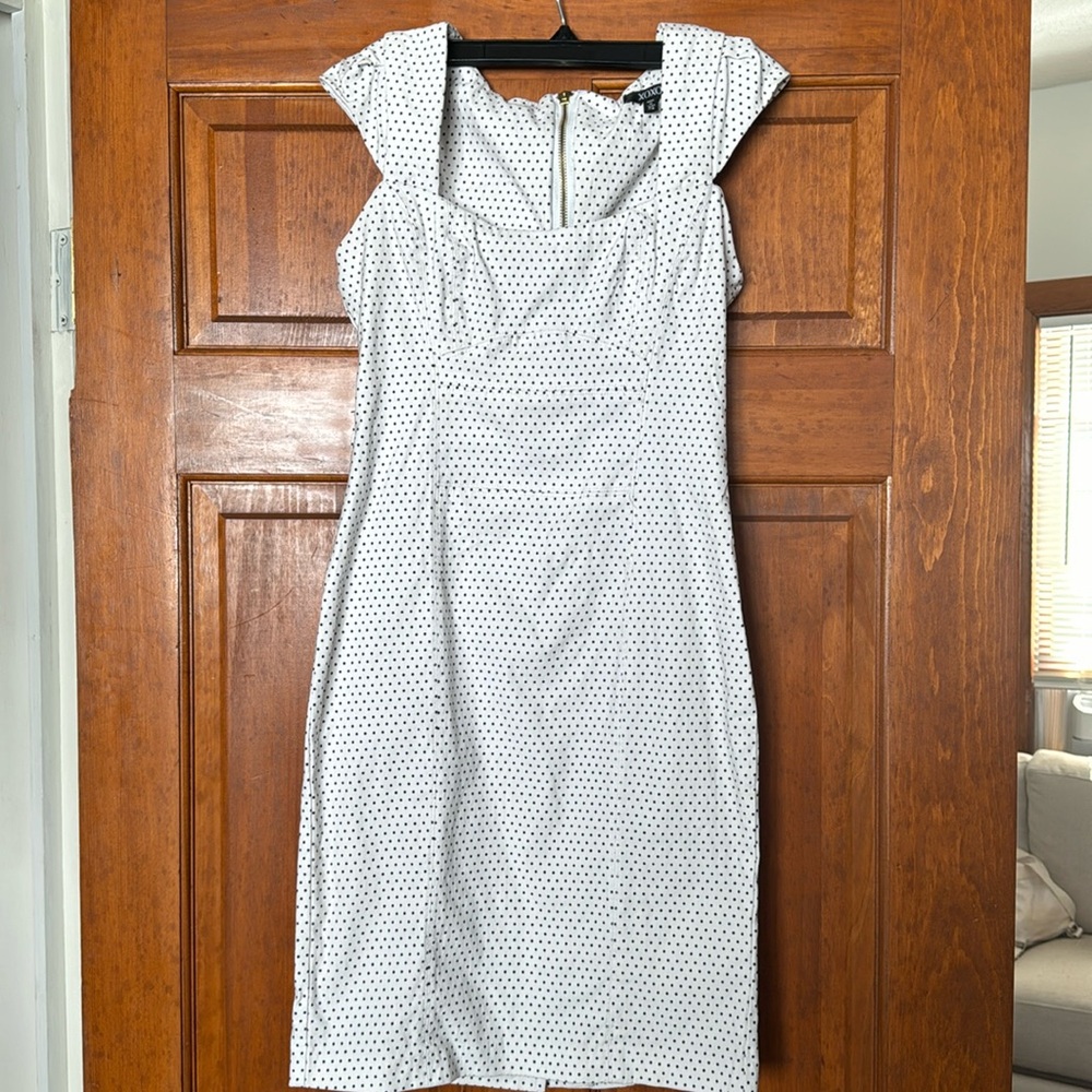 Xoxo form fitting polka dot zip up dress.